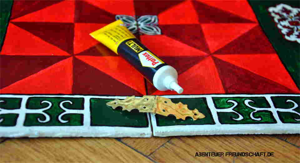 Attach ornamental hinges to the DIY Bagh Chal board