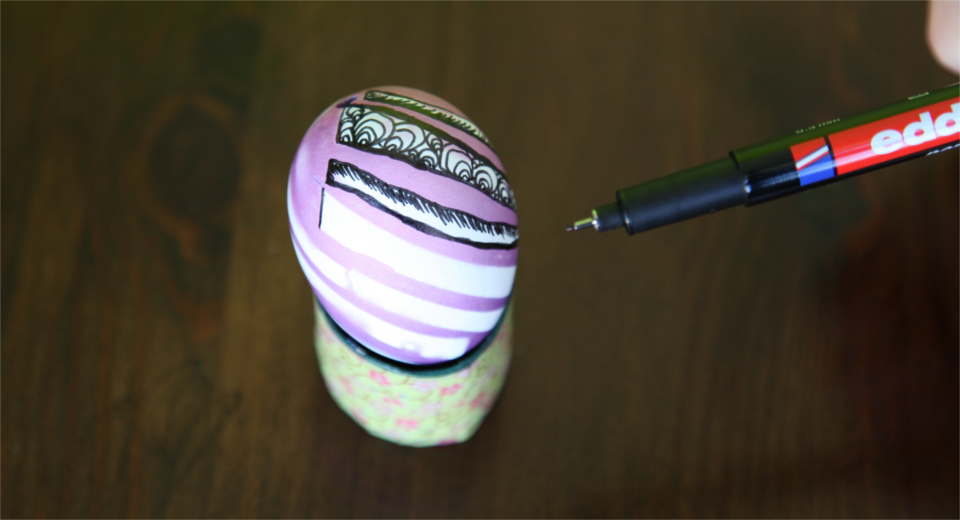Designing patterned Easter eggs with gaffer tape and a thin permanent marker