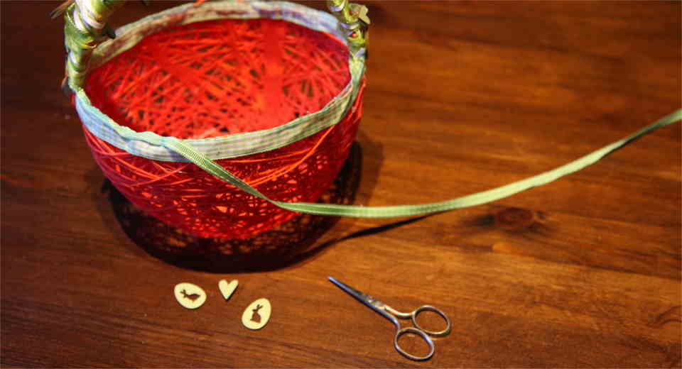 Gluing the border on the Easter basket
