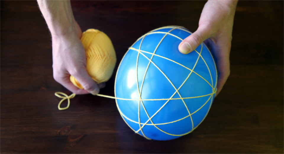 To make a DIY Easter basket, you need to wrap yarn around a balloon