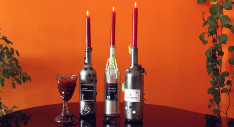 You can make Halloween candle holders from empty bottles 