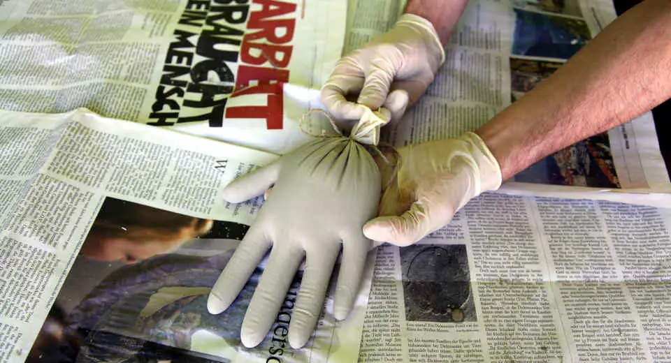 If you want to make your own concrete hand decorations, you will need moulds such as a glove to form a hand.
