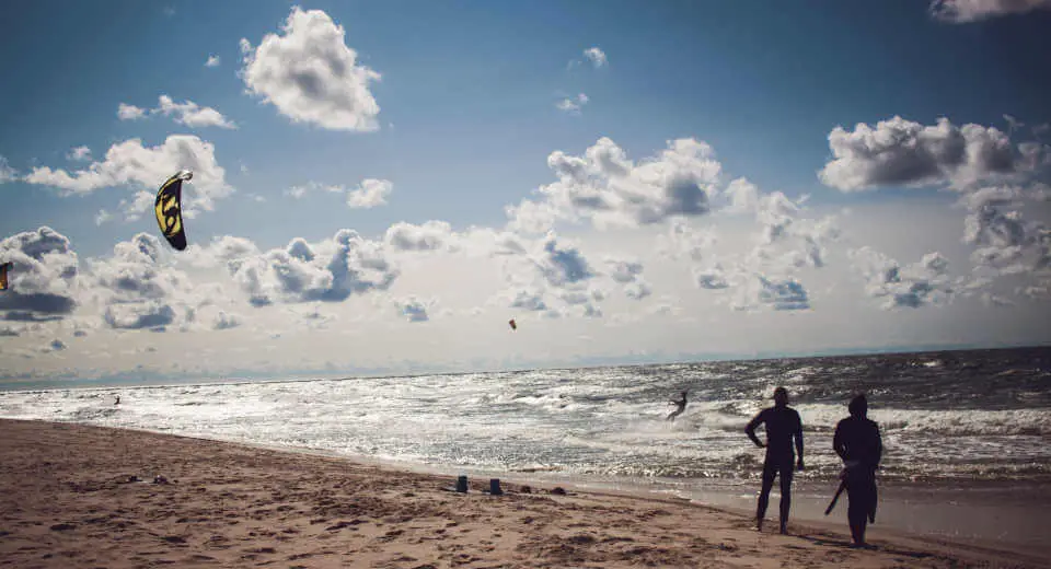 Man with kite on the beach