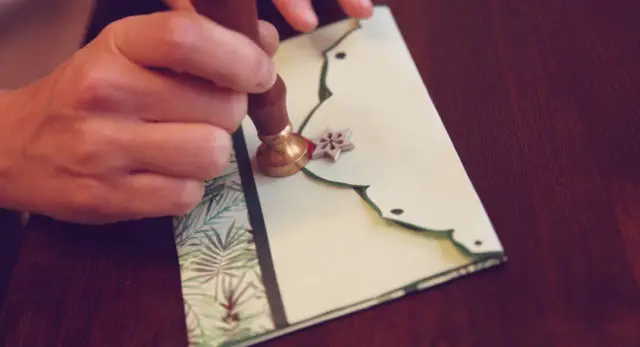 Make an envelope and seal it with a seal and wax. 