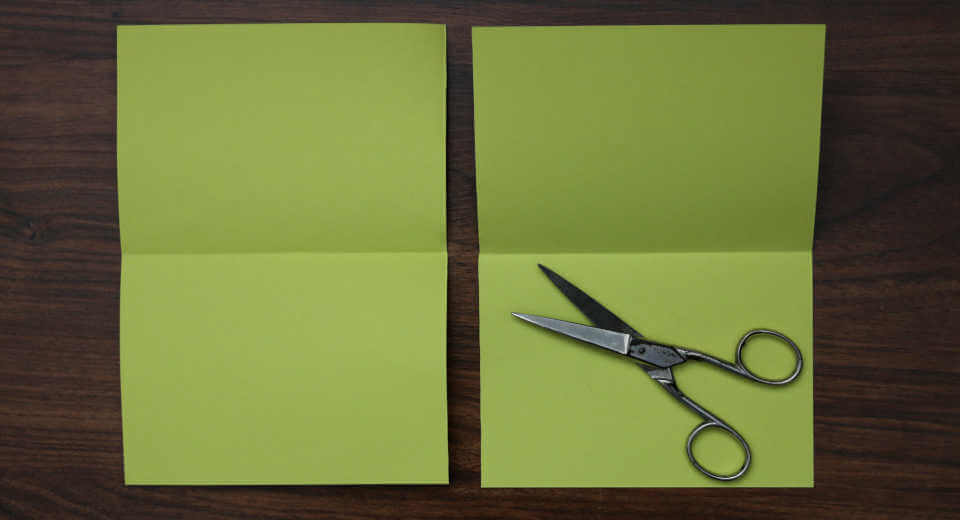 The double-folded card is now cut in half once