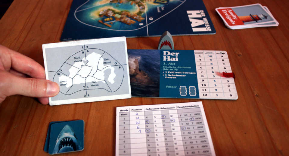 In the Jaws board game, the shark plays alone against the others