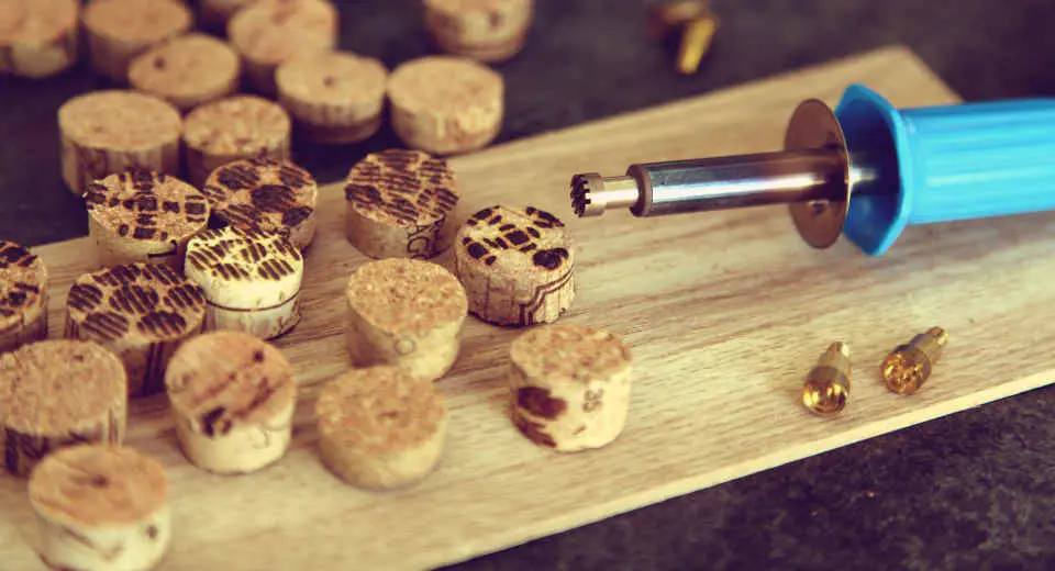 Decorating the cork slices with the stamp attachments on the soldering iron gives them pretty burn patterns