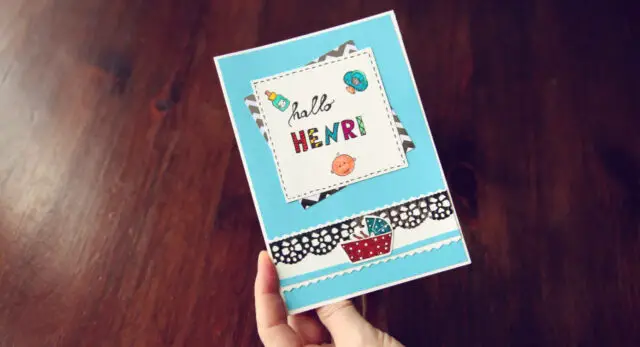 Create a greeting card for the birth with stamps 