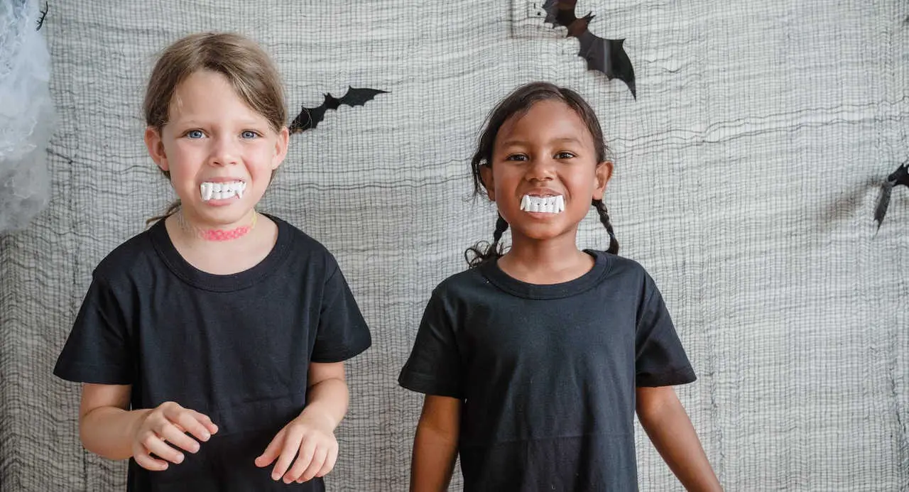 Two little guests at a vampire party for children 