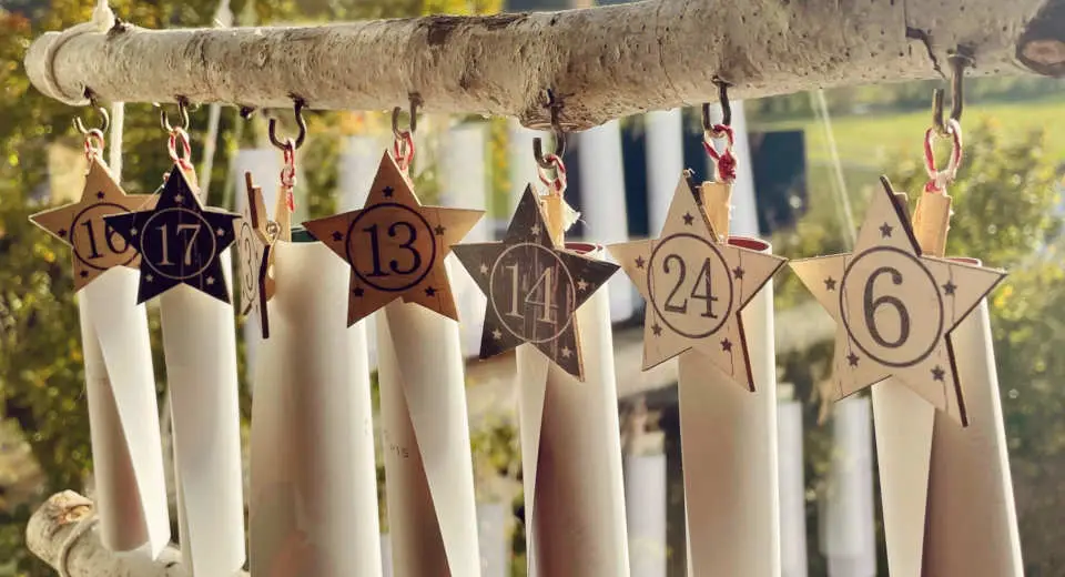 "The DIY puzzle Advent calendar consists of the puzzle cards rolled together and a wooden ladder"